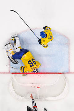 goaltender Linus Ullmark and Adam Larsson of Sweden look