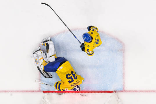 goaltender Linus Ullmark and Adam Larsson of Sweden look