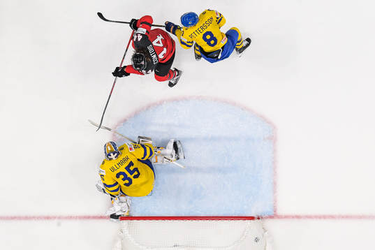 Max Comtois of Canada with goaltender Linus Ullmark and