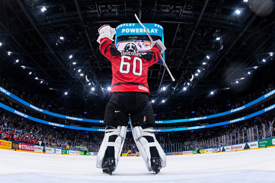 Goaltender Chris Driedger of Canada celebrate the 3-4 goal
