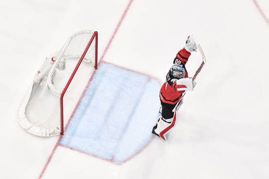Goaltender Chris Driedger of Canada celebrate the 3-4 goal