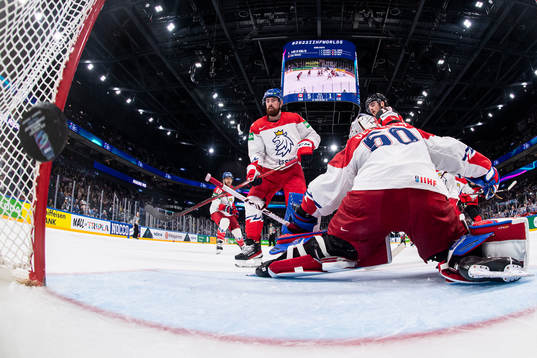 Dylan Cozens of Canada scores the 6-1 goal behind