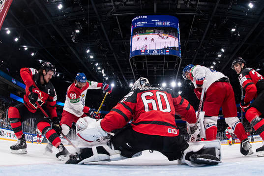 Thomas Chabot of Canada and David Pastrnak of Czech Republic