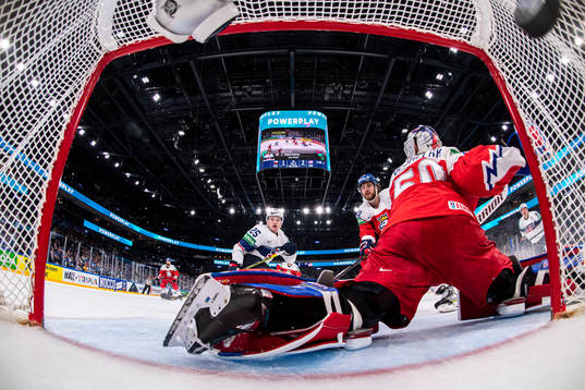 Karson Kaulman of USA scores the 1-3 goal behind goaltender