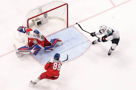 Karson Kaulman of USA scores a goal behind goaltender Karel