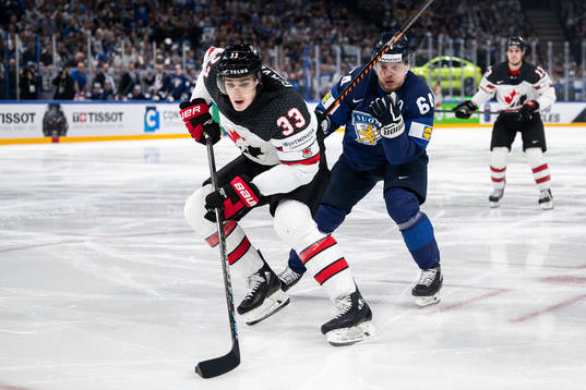 Ryan Graves of Canada and Mikael Granlund of Finland