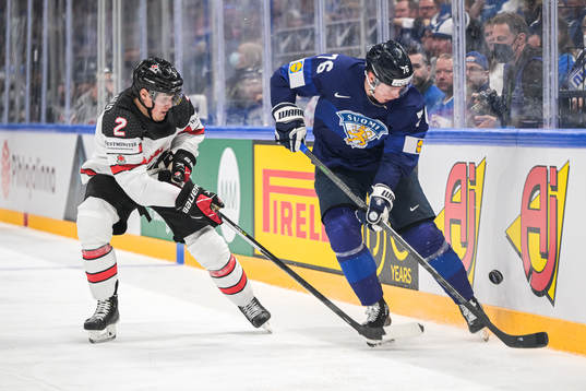 Zach Whitecloud of Canada and Jere Sallinen of Finland