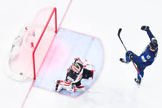 Joel Armia of Finland celebrates and goaltender Matt