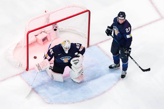 Goaltender Juho Olkinuora and Esa Lindell of Finland looks