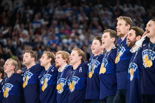 Players of Finland celebrates with gold medals