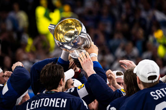 Players of Finland celebrate with the trophy
