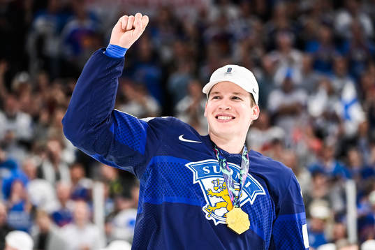 Jere Sallinen of Finland celebrates with gold medal