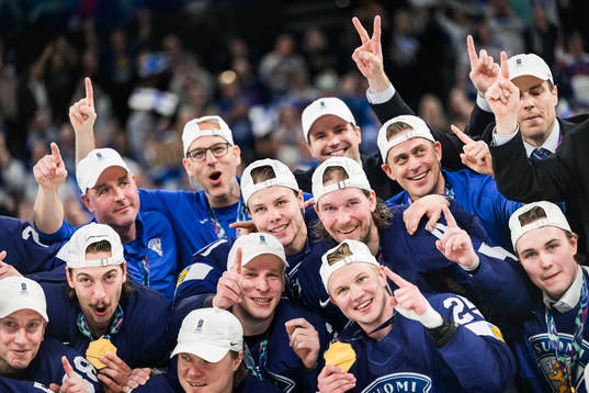 Players of Finland celebrating with gold medals