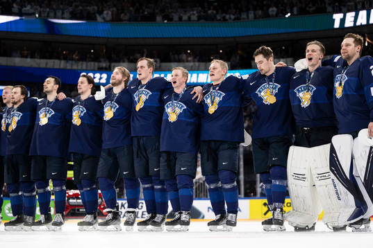 Players of Finland celebrate their gold medals