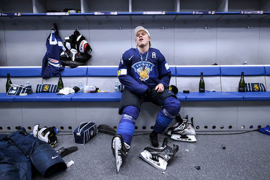 Mikael Granlund of Finland celebrate in the locker room