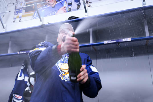 Harri Pesonen of Finland celebrate in the locker room