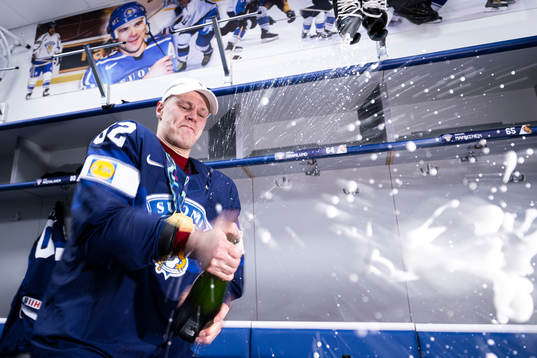 Harri Pesonen of Finland celebrate in the locker room