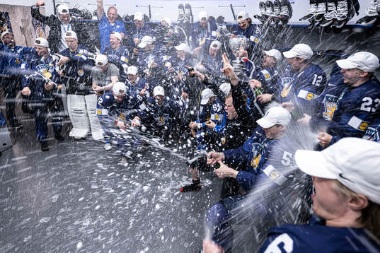 The team of Finland celebrate in the locker room