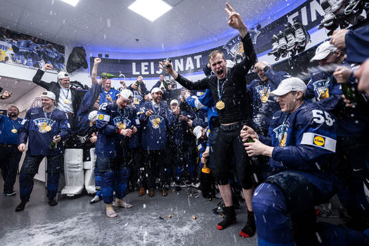 The team of Finland celebrate in the locker room