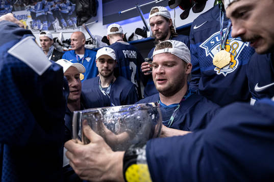 Teemu Hartikainen of Finland celebrate in the locker room