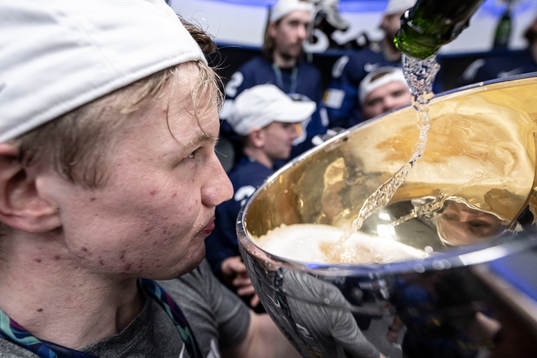 Toni Rajala of Finland celebrate in the locker room