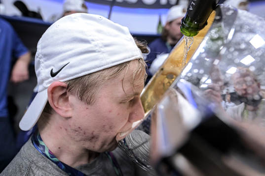 Toni Rajala of Finland celebrate in the locker room