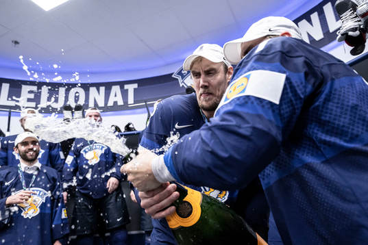 Marko Antilla and Valtteri Filppula of Finland celebrate in
