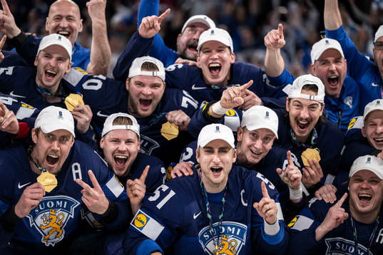 Marko Antilla and Valtteri Filppula of Finland celebrate