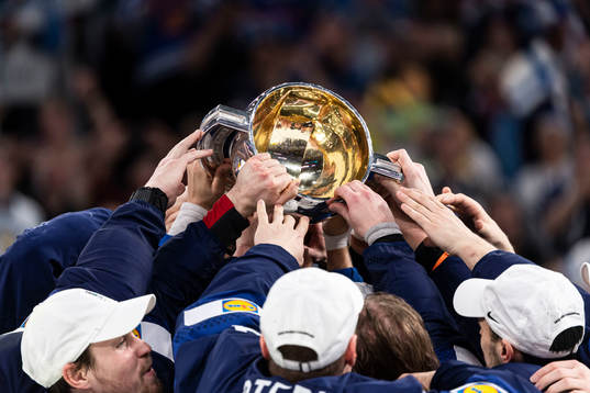 Players of Finland celebrate with the trophy
