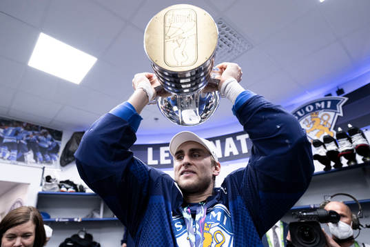 Valtteri Filppula of Finland celebrates with the trophy in
