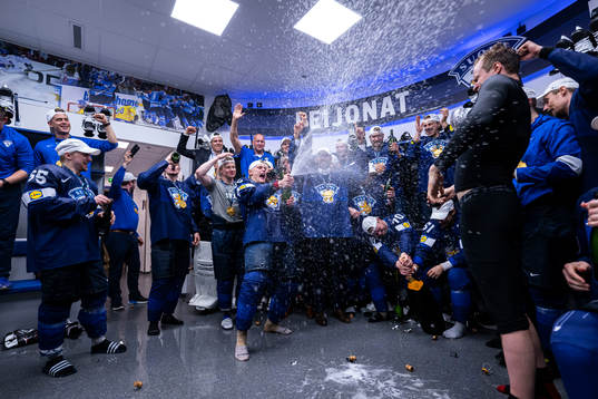 Harri Pesonen of Finland celebrate with teammates in the
