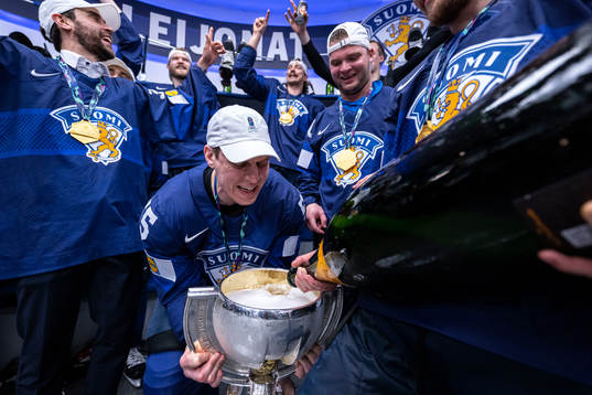 Atte Ohtamaa of Finland celebrates in the locker room with