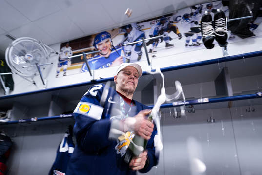 Harri Pesonen of Finland celebrate in the locker room