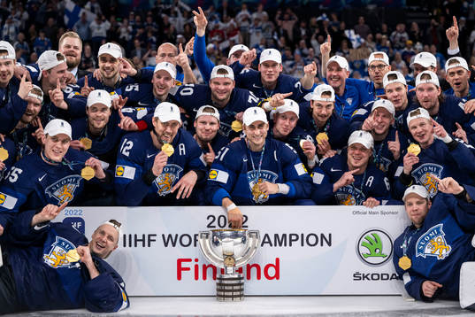 The players of Finland celebrate with the trophy