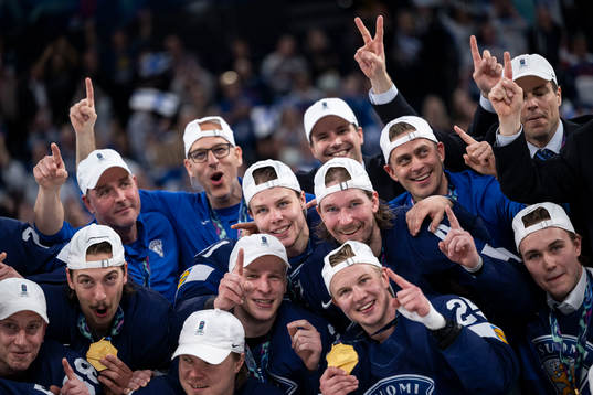 The players of Finland celebrate with their gold medals