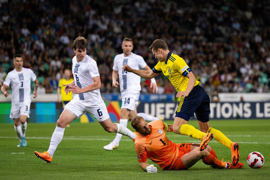 Jaka Bijol and goalkeeper Jan Oblak of Slovenia against