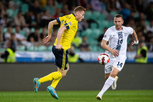 Dejan Kulusevski of Sweden and Jasmin Kurtic of Slovenia