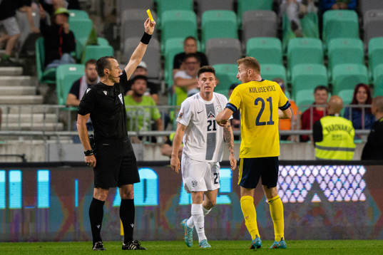 Referee Ruddy Buquet and Dejan Kulusevski of Sweden