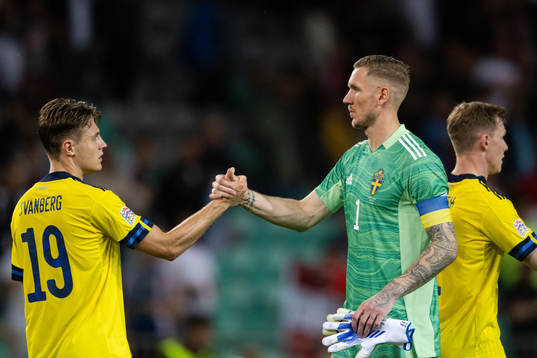 Mattias Svanberg and goalkeeper Robin Olsen of Sweden
