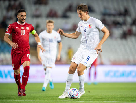 Dusan Tadić of Serbia and Sander Berge of Norway