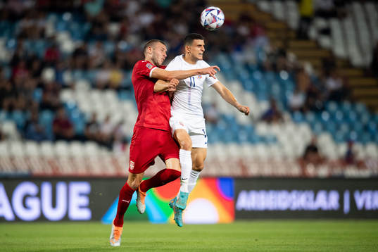 Strahinja Pavlović of Serbia and Mohamed Elyounoussi of