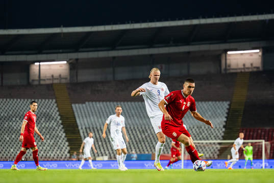 Erling Braut Haaland of Norway and Nikola Milenković of
