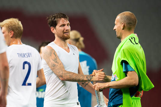 Stefan Strandberg and goalkeeper André Hansen of Norway