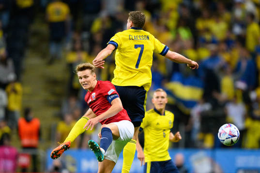 Martin Ødegaard of Norway and Viktor Claesson of Sweden