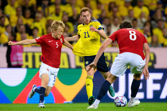 Birger Meling of Norway and Dejan Kulusevski of Sweden