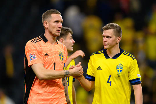Goalkeeper Robin Olsen and Joakim Nilsson of Sweden