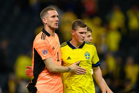 Goalkeeper Robin Olsen and Joakim Nilsson of Sweden
