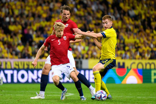 Birger Meling of Norway and Dejan Kulusevski of Sweden
