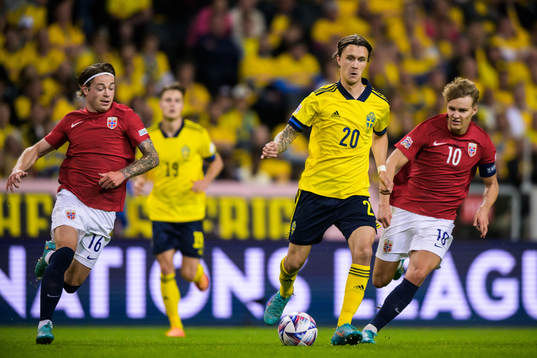 Patrick Berg and Martin Ødegaard of Norway are being