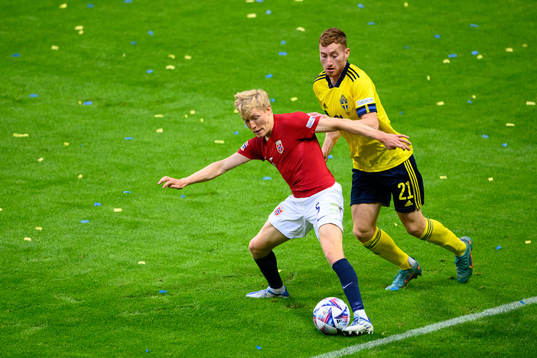 Birger Meling of Norway and Dejan Kulusevski of Sweden